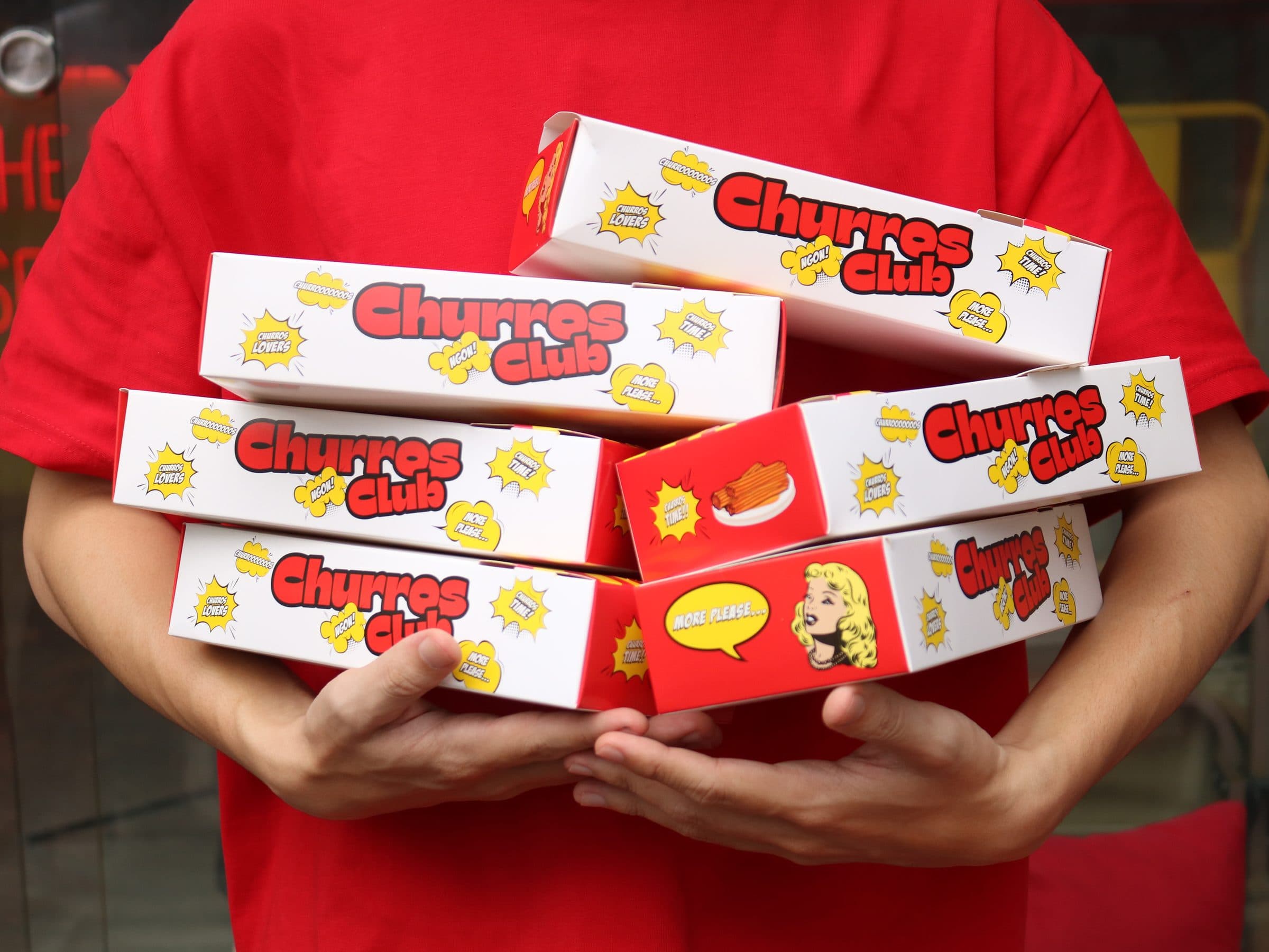 Churros Club serving fresh churros for an event